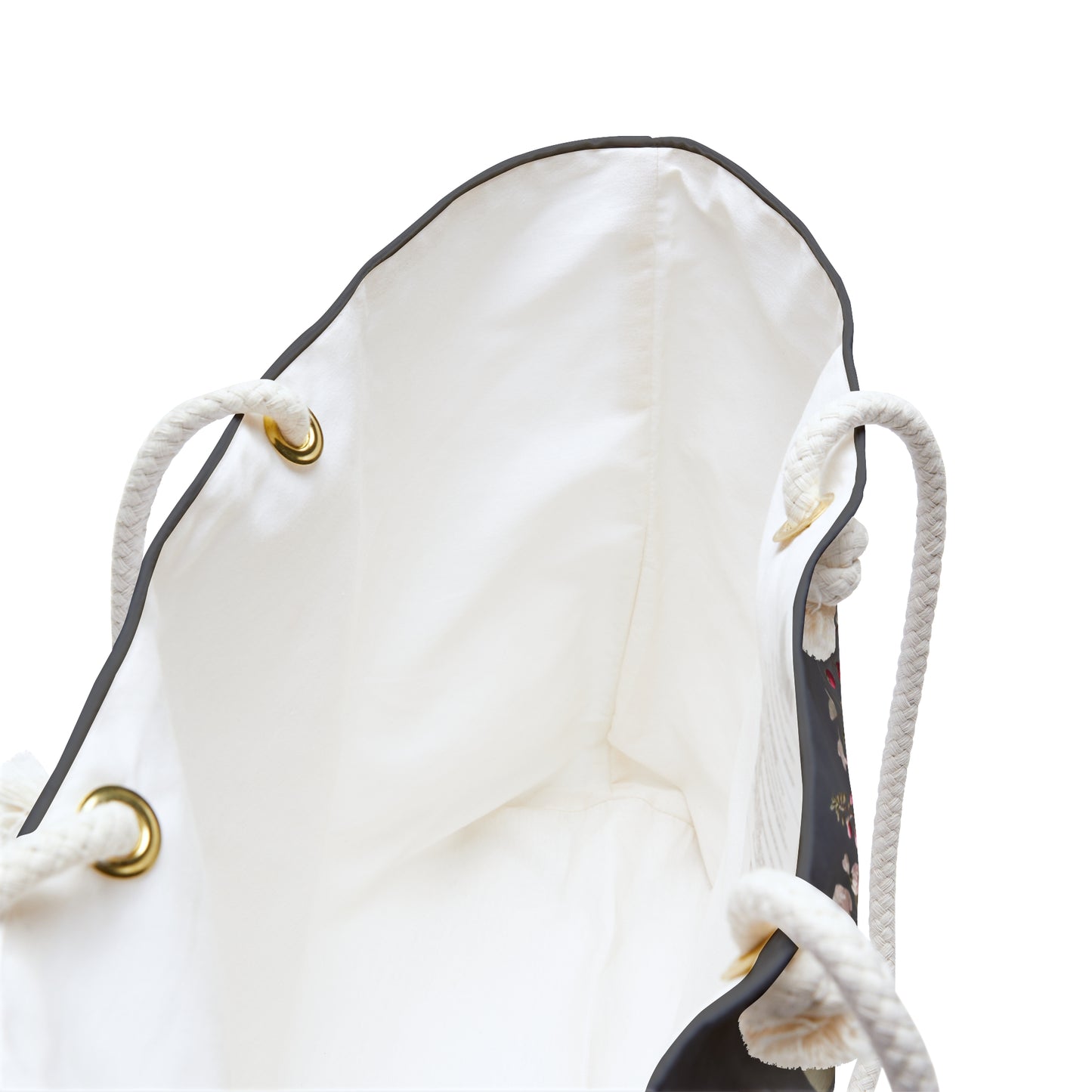 White drawstring bag with gold eyelets looking deep inside