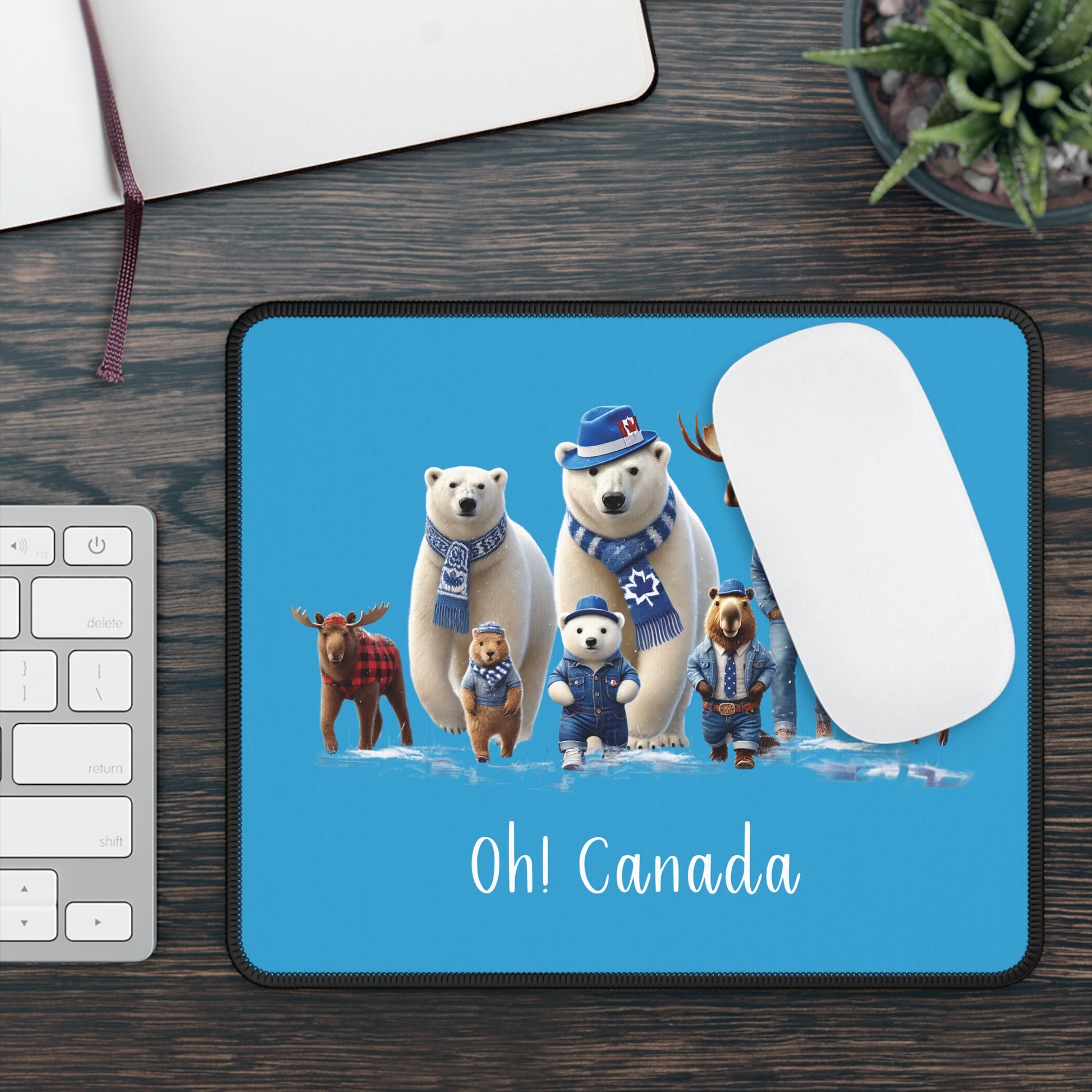 Mouse pad with polar bears and moose design on a desk