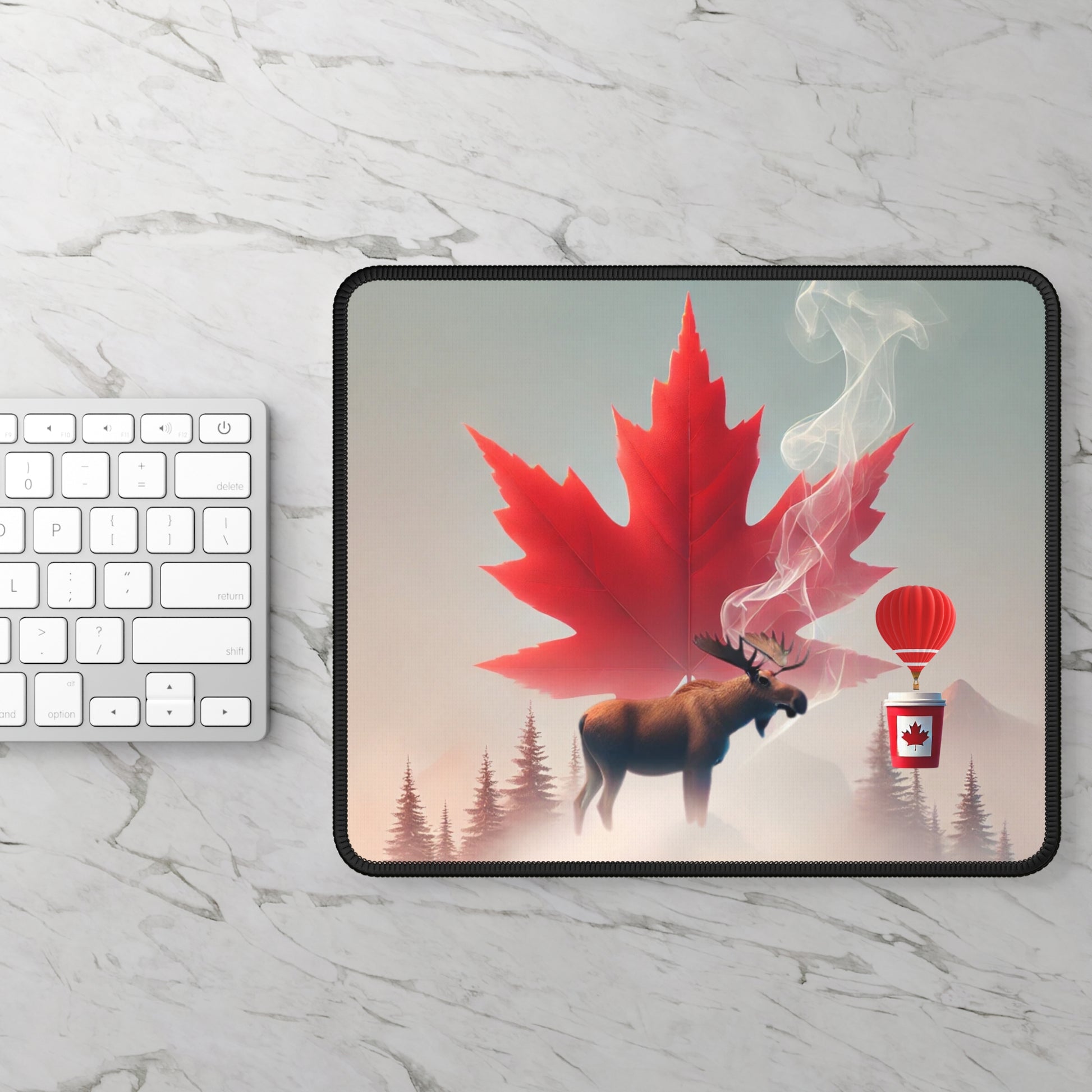 Mousepad with a red maple leaf and moose design on a marble surface with a keyboard.