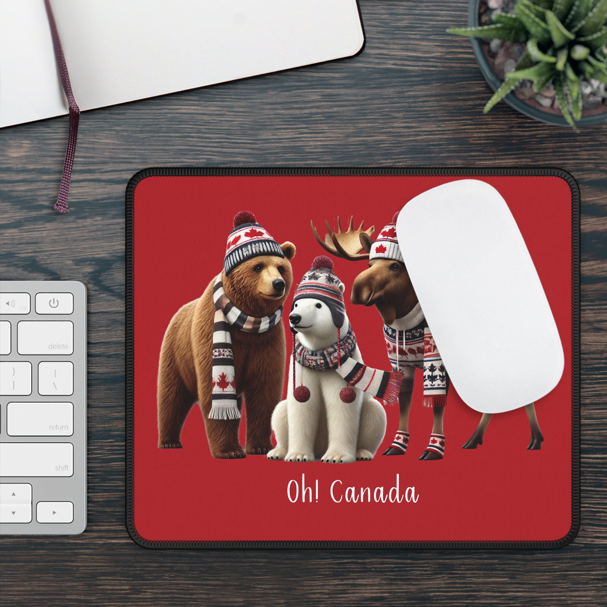 Mouse pad with Canadian-themed animals on a desk