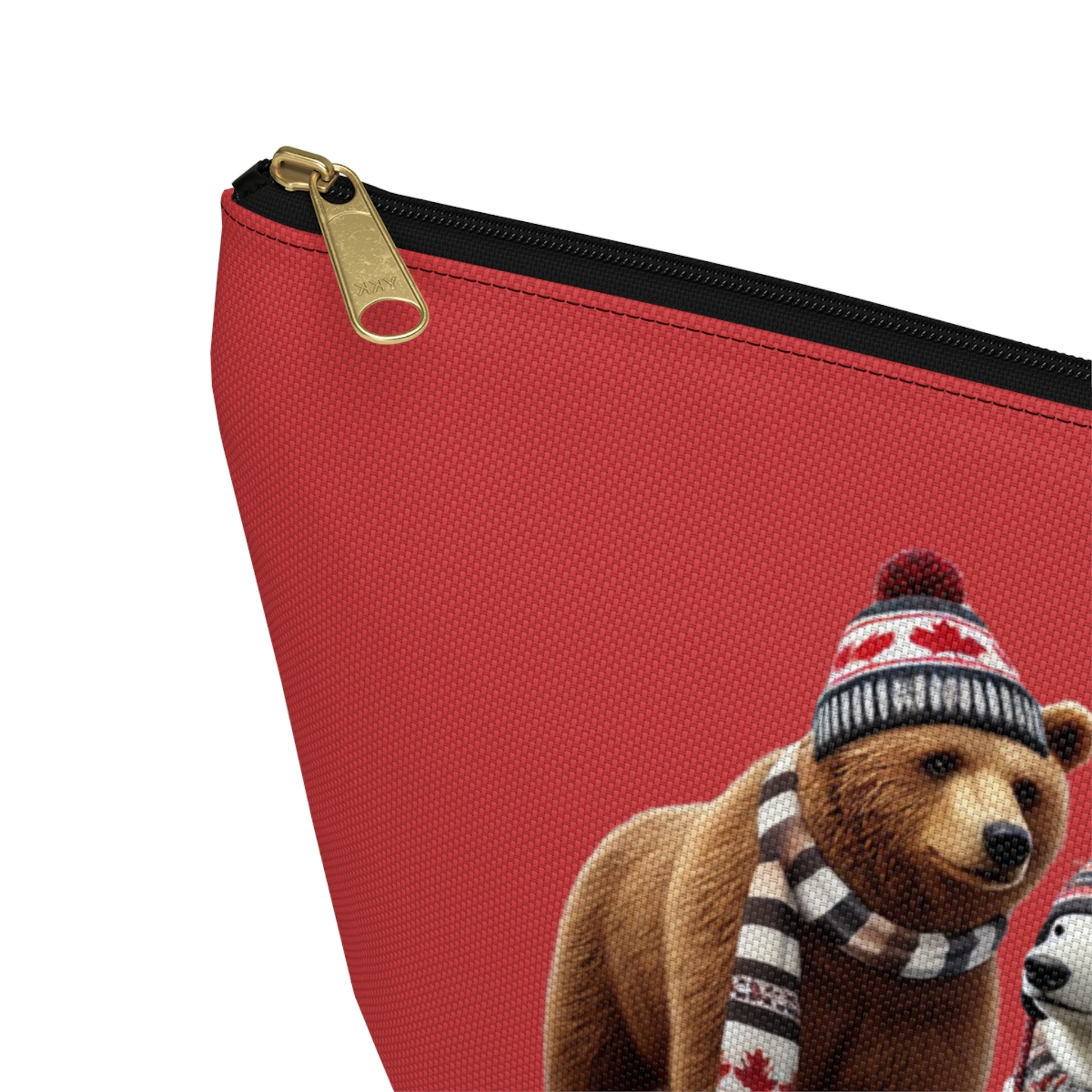 Large red make-up pouch with a bear wearing a hat and scarf on a white background - Canadiana, zipper close up