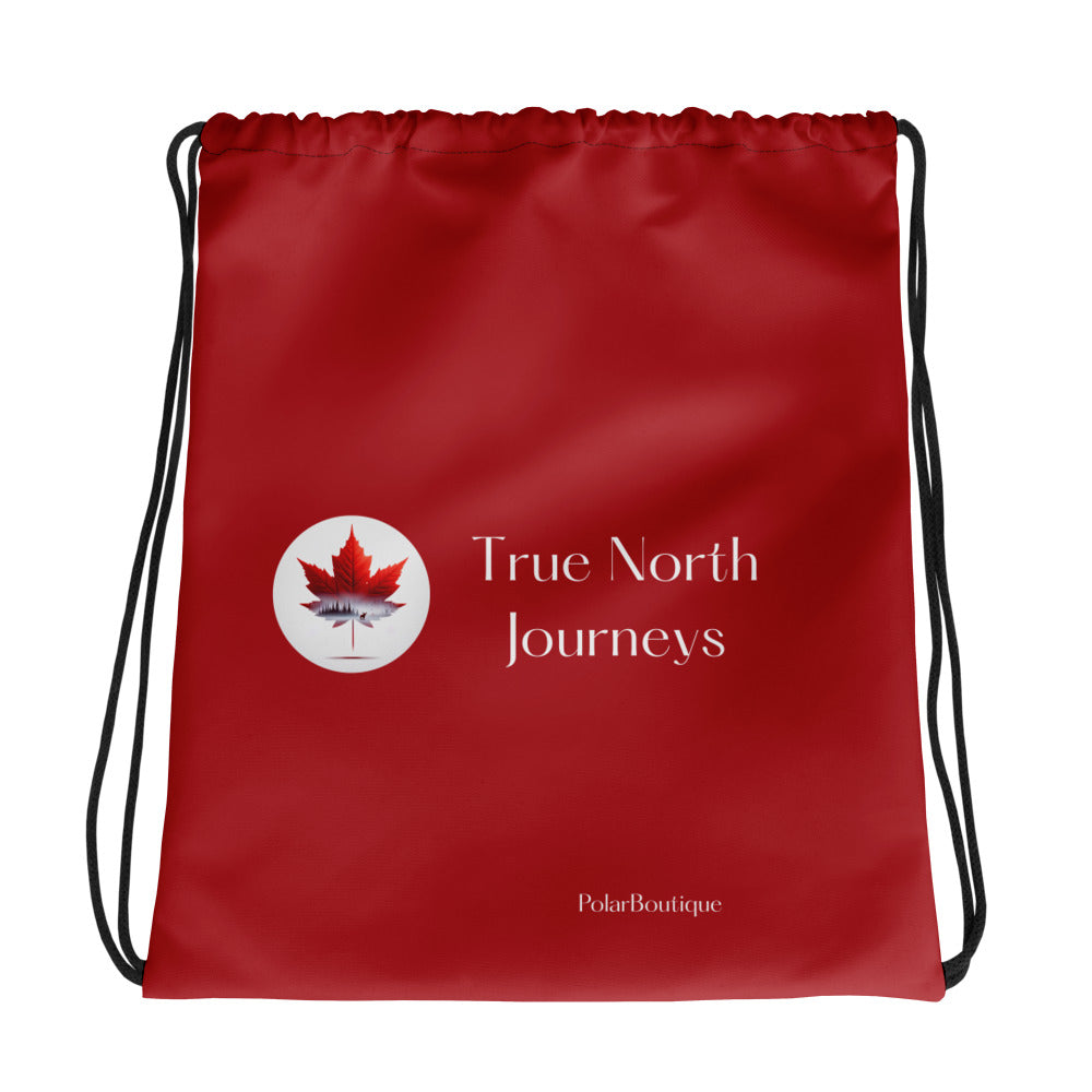Red drawstring bag with 'True North Journeys' logo on a white background. Back side.
