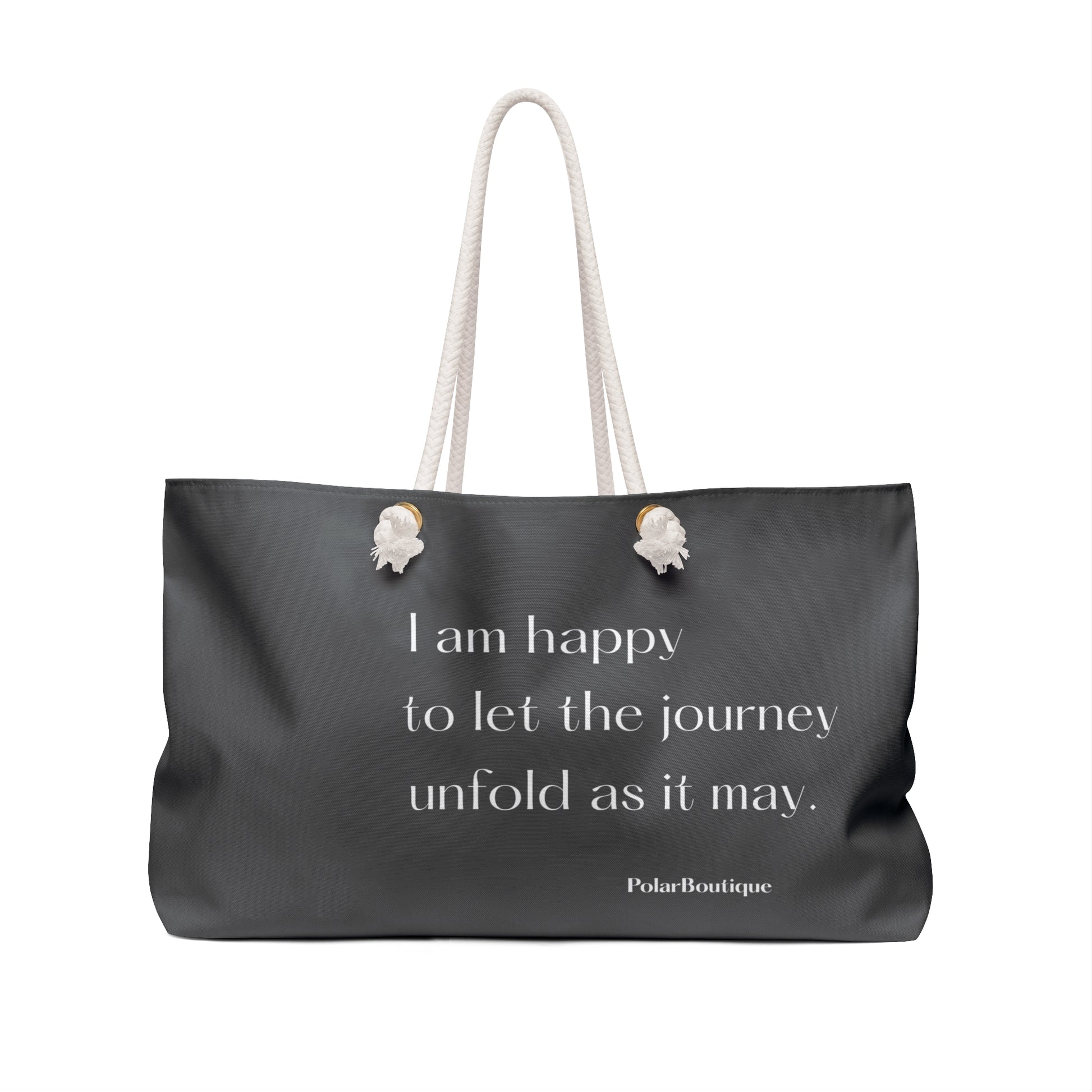 Gray tote bag with a quote and brand name on a white, background