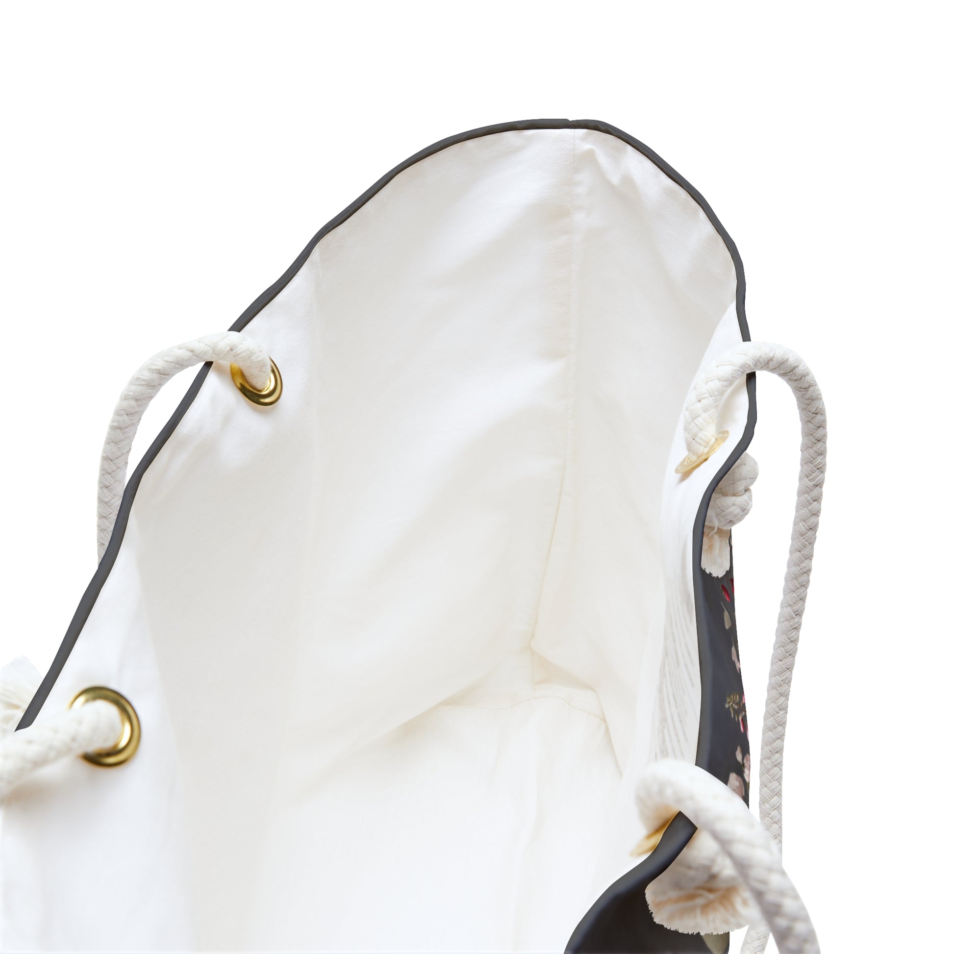 White drawstring bag with gold eyelets looking deep inside