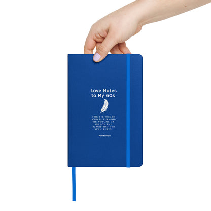 holding journal titled, Love Notes to my 60s royal blue