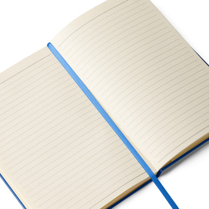 Open notebook with blue silk bookmark lying on a white background