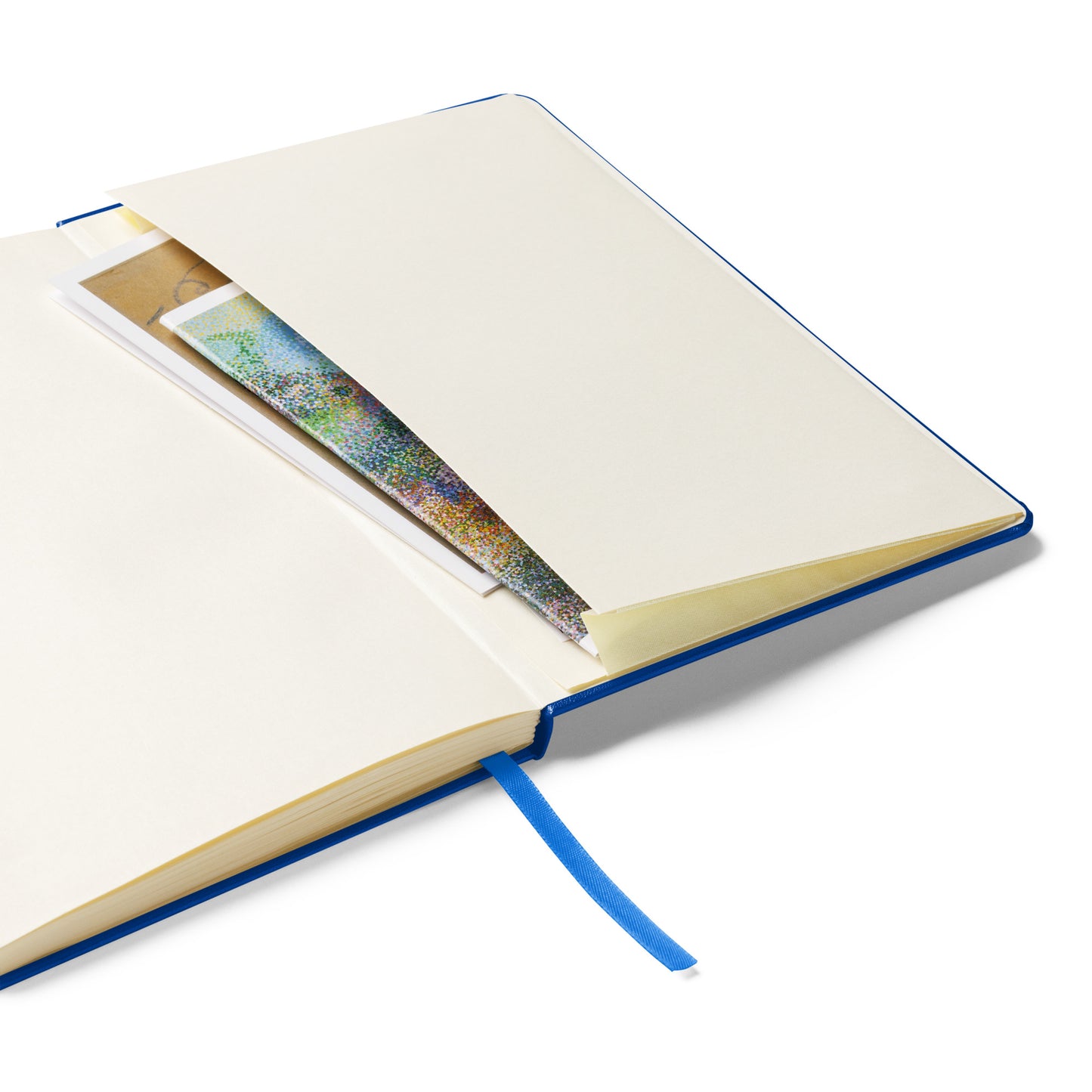 Open notebook with a colorful page peeking out on a white background