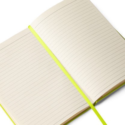 Open notebook with green binding on a white background, green silk bookmark