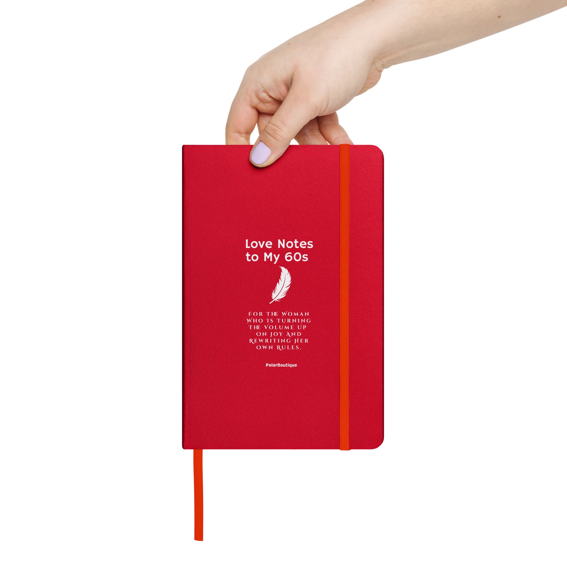 holding red journal titled, Love Notes to My 60s 